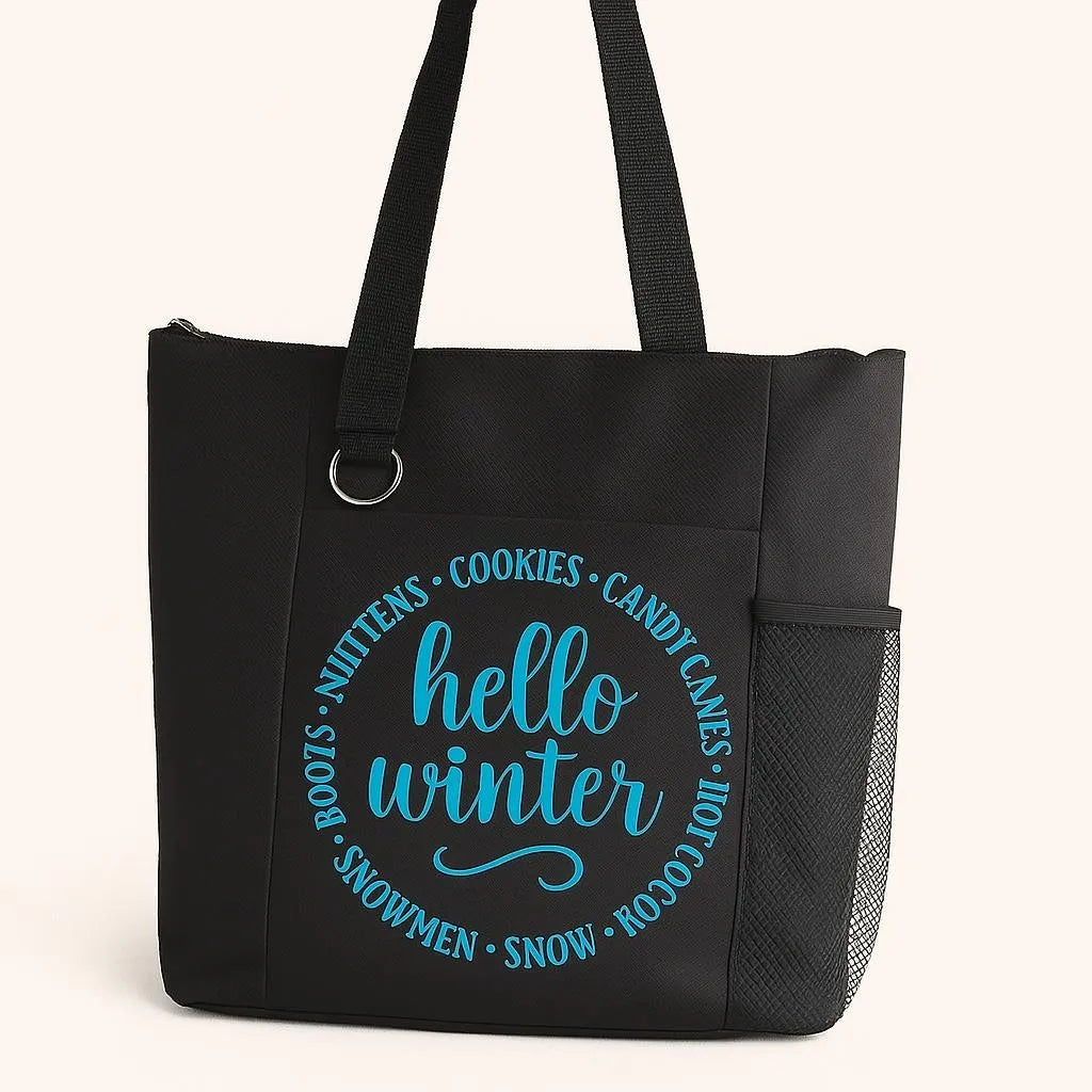 Black tote bag featuring a blue circular "Hello Winter" design with seasonal icons including mittens, cookies, candy canes, hot cocoa, and winter-themed elements. Reusable tote bag perfect for shopping, errands, winter outings, holiday gifting, carrying books, groceries, and everyday essentials. Lightweight and durable with comfortable shoulder straps for seasonal style and practical use.