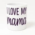 White ceramic mug featuring the phrase "I Love My Mama" in soft purple lettering. Thoughtful gift mug for moms, Mother's Day, birthdays, Christmas, and everyday appreciation. Perfect for coffee, tea, hot cocoa, and daily use at home or the office.