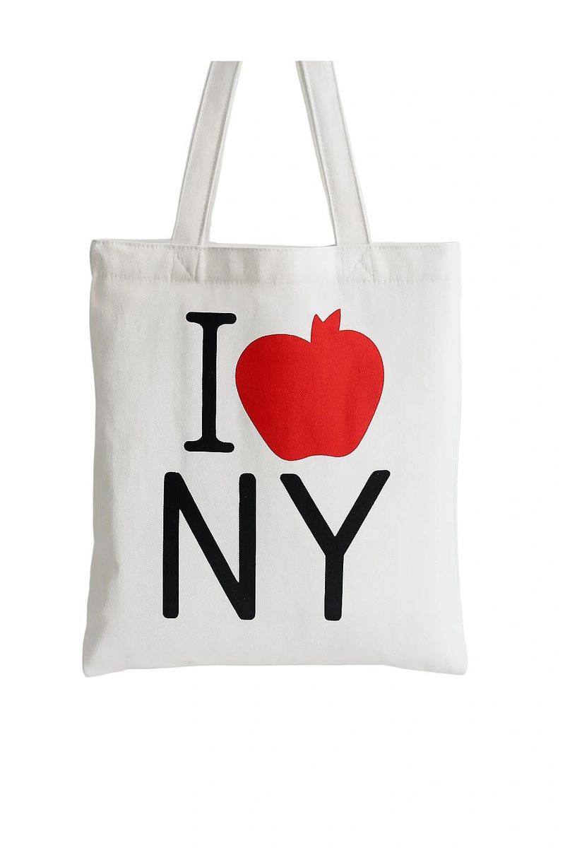 White canvas I Love NY tote bag featuring classic New York inspired graphic with red apple accent. Lightweight reusable shopping tote with minimalist city design, casual everyday style, and practical carry-all use for travel or errands.