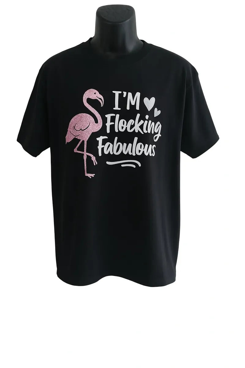 Black t-shirt with pink flamingo graphic and text on a mannequin against a white background