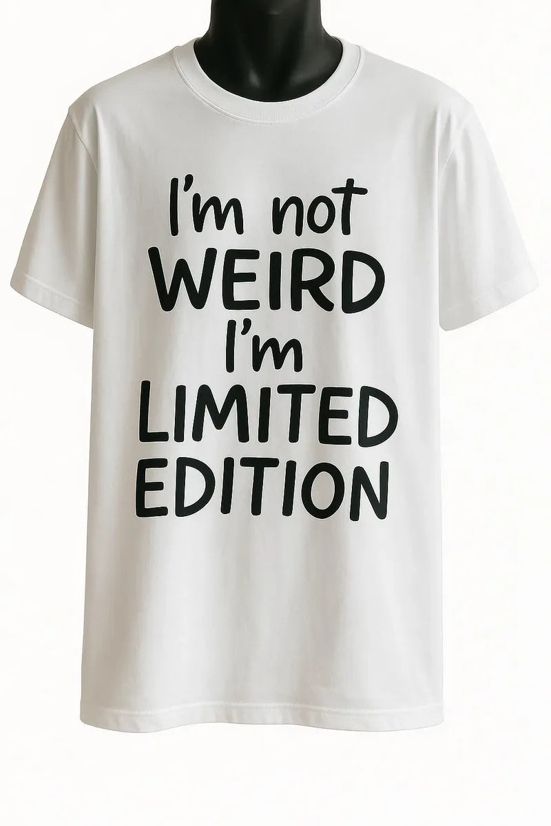 White graphic t-shirt featuring the quote "I'm Not Weird I'm Limited Edition" in bold black typography, inspirational unisex statement tee for everyday casual wear.