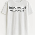 White graphic t-shirt featuring the phrase "Introverted Extrovert" in minimalist typography. Funny personality statement shirt perfect for introverts, extroverts, ambiverts, casual wear, social humor, and everyday fashion.