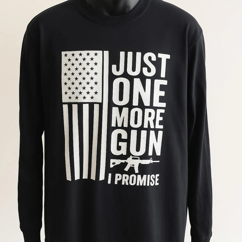 Black long sleeve graphic shirt featuring “Just One More Gun I Promise” text with American flag design. Patriotic unisex apparel with bold statement print, casual comfortable fit, freedom-themed graphic top for everyday wear.
