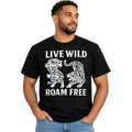 A man wearing a black short-sleeve t-shirt with a white graphic print of two roaring tigers and the text 'LIVE WILD ROAM FREE'.
