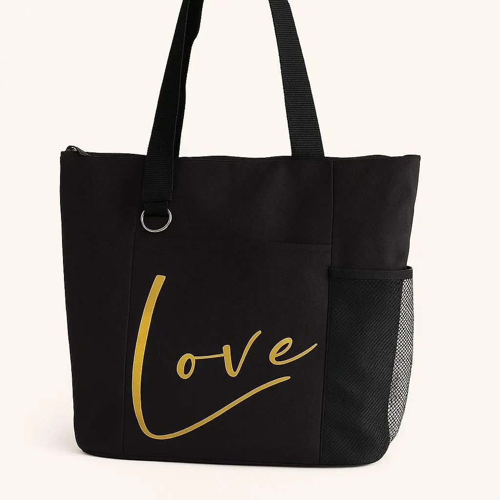 Black tote bag featuring the word "Love" in elegant gold script lettering. Minimalist reusable tote bag designed for shopping, work, travel, books, groceries, and everyday essentials. Stylish shoulder bag with a timeless inspirational design, perfect for gifting, daily use, and modern fashion lovers.