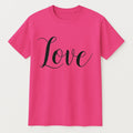 Pink graphic t shirt featuring the word Love in elegant script lettering, perfect for everyday wear, gifting, Valentine's Day, and positive fashion styling.
