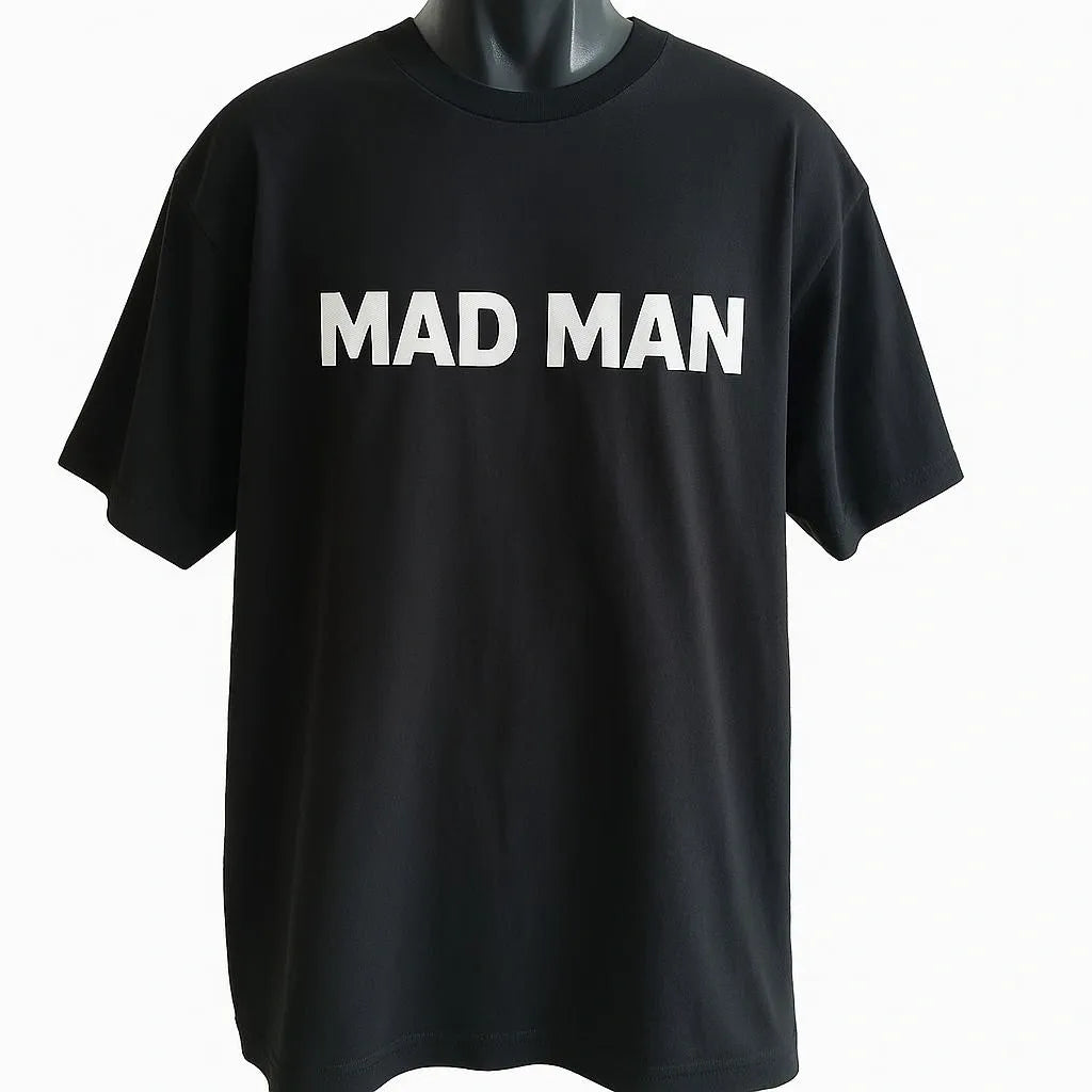 Black MAD MAN graphic short sleeve t-shirt with bold white text design, minimalist unisex streetwear tee for casual everyday fashion and modern urban style by LB AND SK DESIGN SHOP