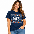 Woman wearing a navy Fall Season graphic T-shirt with white and orange autumn design.