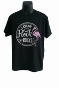 Black graphic T-shirt featuring a flamingo design and the phrase "Our Flock Rocks." Fun tropical graphic tee for flamingo lovers, beach vacations, summer outings, and casual wear.