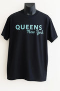 Black graphic t-shirt featuring the phrase "Queens Never Quit" in stylish typography, motivational women's statement tee for confidence and everyday wear.