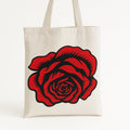 Red rose graphic tote bag with bold floral illustration on reusable canvas shopping bag for everyday use, shopping, work, gifts, and flower lovers.