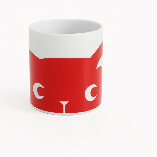 Red mug with white cat face design on a white background