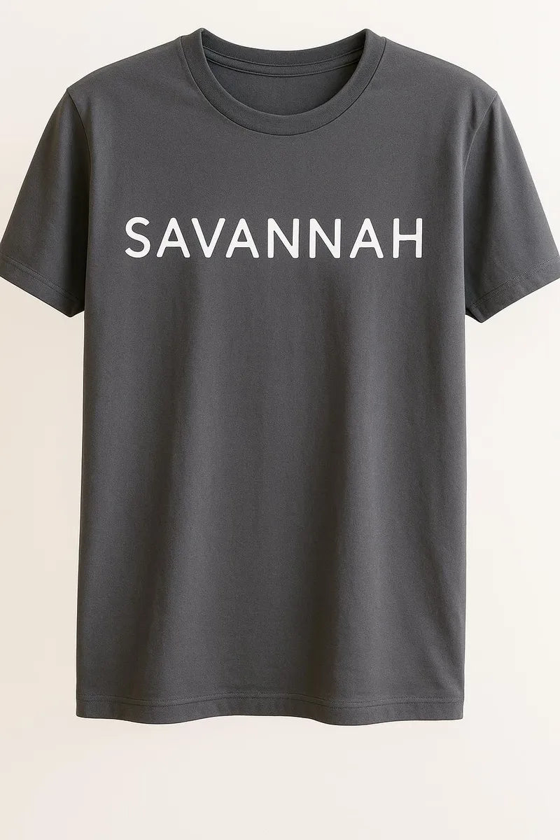 Gray unisex graphic T shirt featuring the word Savannah in bold white typography on the front with a clean minimalist design.