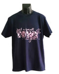 Navy blue graphic T-shirt with “Just a Small Town Girl” pink text design on a mannequin against a white background