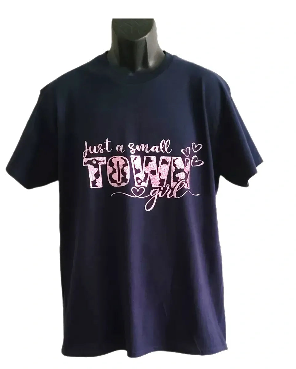 Navy blue graphic T-shirt with “Just a Small Town Girl” pink text design on a mannequin against a white background
