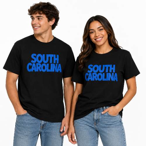 Male and female models wearing matching black South Carolina graphic T-shirts with bold blue lettering and blue jeans on a white background.