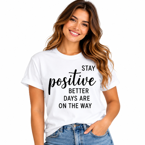 Woman wearing a white Stay Positive T-shirt with black Better Days Are On The Way lettering.