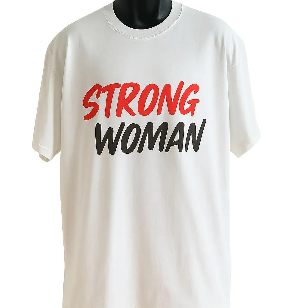 White graphic T-shirt featuring a bold Strong Woman typography design in red and black. Inspirational women's empowerment shirt for casual wear, fitness, and everyday confidence.
