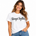 Woman wearing a white Stronger Together graphic T-shirt with black script lettering.