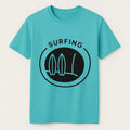 Blue surfing graphic short sleeve t-shirt with minimalist surfboard wave design on soft casual unisex tee for beach, summer, and coastal style fashion