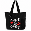 Black Sweet and Sassy tote bag with white script, red heart design, shoulder straps and side mesh pocket