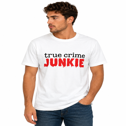 A man wearing a white crewneck t-shirt with 'true crime JUNKIE' printed on the chest, paired with blue jeans, against a plain white background.
