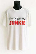 White graphic t-shirt featuring the phrase "True Crime Junkie" in bold black and red lettering. Comfortable casual tee designed for true crime podcast fans, mystery lovers, documentary watchers, and everyday wear. Soft classic fit shirt perfect for lounging, travel, casual outings, and gifting.