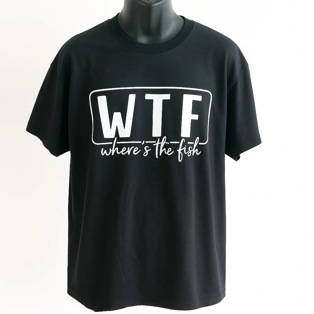 Black graphic t-shirt featuring the humorous phrase “WTF Where’s The Fish” in bold white lettering. Funny fishing shirt for anglers, fishermen, fishing trips, lake weekends, outdoor adventures, and casual everyday wear.