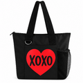 Black XOXO tote bag with red heart, black letters, zipper, shoulder straps, and side mesh pocket