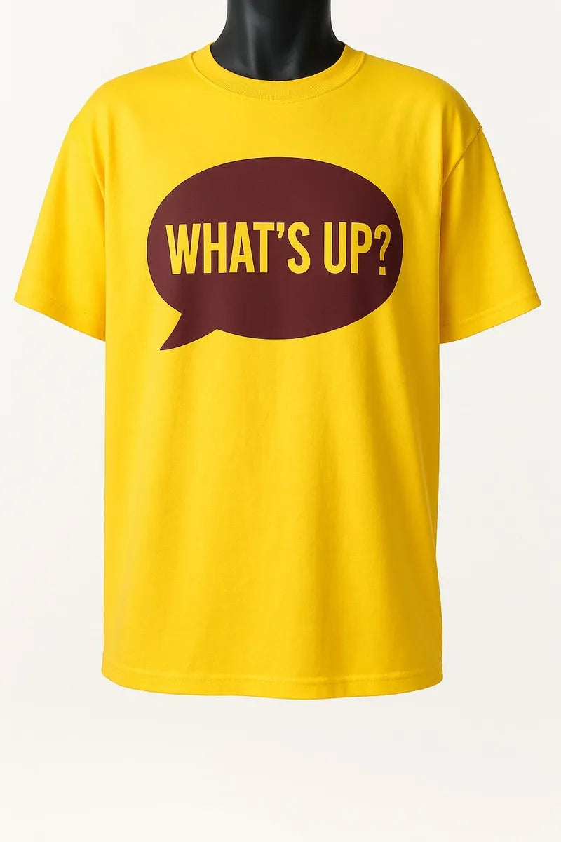 Bright yellow graphic t-shirt featuring a bold “What’s Up?” speech bubble design, casual unisex short sleeve tee for everyday wear.